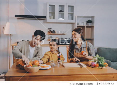 Family spends their free time together Family spends their free time together 130228672