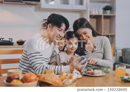 Family spends their free time together Family spends their free time together 130228699