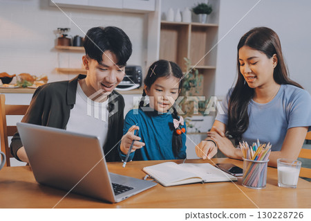 Family spends their free time together Family spends their free time together 130228726