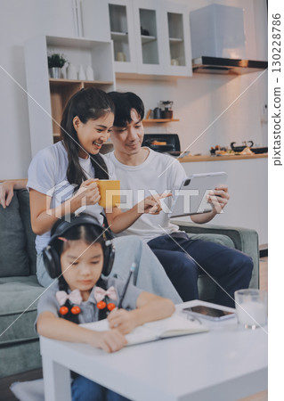 Family spends their free time together Family spends their free time together 130228786