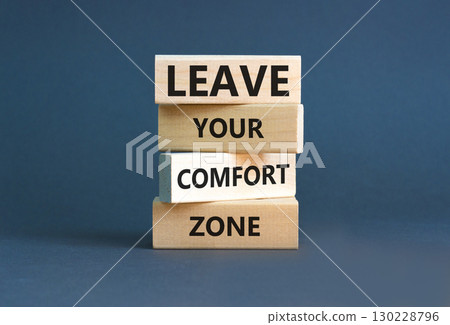 Leave your comfort zone symbol. Concept words Leave your comfort zone on beautiful wooden blocks. Beautiful grey paper background. Business psychological Leave your comfort zone concept. Copy space. 130228796