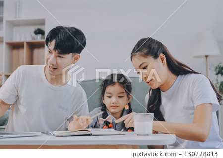 Family spends their free time together Family spends their free time together 130228813