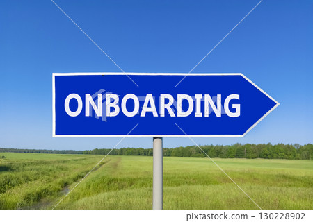 Onboarding success symbol. Concept word Onboarding on beautiful blue road sign. Beautiful blue sky green grass and forest peaceful nature background. Business onboarding success concept. Copy space. 130228902
