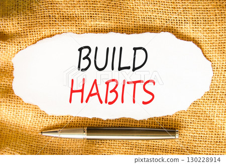 Build habits symbol. Concept word Build habits on beautiful white paper. Beautiful canvas background. Black pen. Business build habits concept. Copy space. 130228914