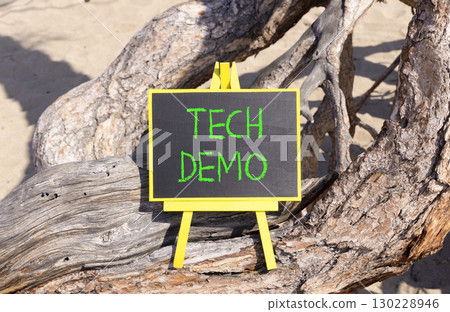Tech demo symbol. Concept word Tech demo on beautiful black blackboard. Beautiful old tree background. Black blackboard. Business tech demo concept. Copy space. Tech demo symbol. Concept word Tech demo on beautiful black blackboard. Beautiful old tree background. Black blackboard. Business tech demo concept. Copy space. 130228946
