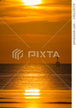 Over the lighthouses of is a beautiful gradient sky created by sunrise 130229174