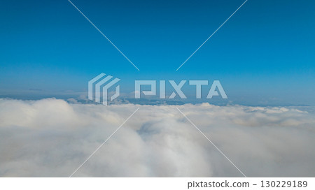 Aerial view of the mist cover the mountain at beautiful sunrise Aerial view of the mist cover the mountain at beautiful sunrise 130229189