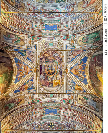 VATICAN CITY, ROME, ITALY - AUGUST 02, 2025 Magnificent vaulted ceiling with a rich tapestry of intricate frescoes and paintings. The panels are filled with a riot of colors and figures VATICAN CITY, ROME, ITALY - AUGUST 02, 2025 Magnificent vaulted ceiling with a rich tapestry of intricate frescoes and paintings. The panels are filled with a riot of colors and figures 130229736