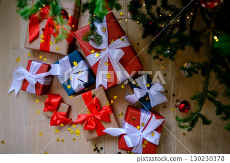 Lots of Christmas presents under the decorated Christmas tree. Lots of Christmas presents under the decorated Christmas tree. 130230378