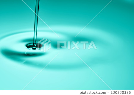 The oil flows and collects into a drop. The texture of the cosmetic product. The oil flows and collects into a drop. The texture of the cosmetic product. 130230386