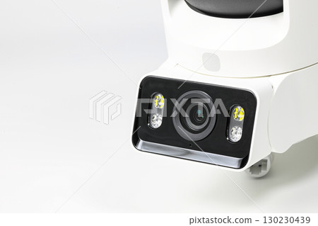 close-up shot lens of home security camera on white background. 130230439