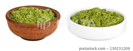 Pesto sauce in ceramic bowl isolated on white background Pesto sauce in ceramic bowl isolated on white background 130231209