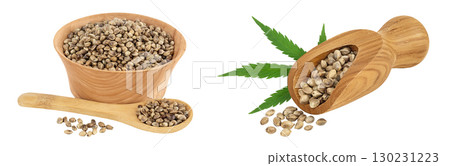 Hemp seeds in wooden bowl and scoop isolated on white background with full depth of field Hemp seeds in wooden bowl and scoop isolated on white background with full depth of field 130231223