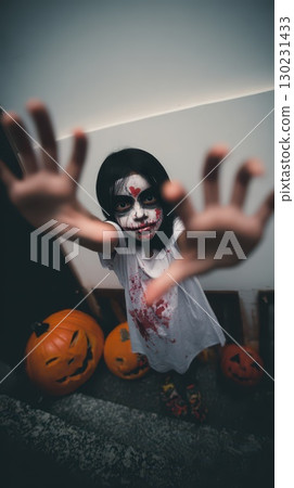 Halloween child in spooky decor 130231433