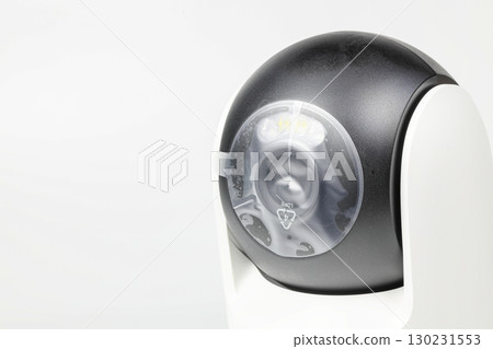 close-up shot lens with film protection of brand new home security camera on white background. close-up shot lens with film protection of brand new home security camera on white background. 130231553