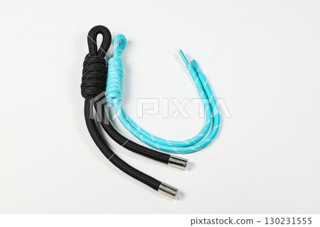 close up of color nylon shoelace isolated on white background. close up of color nylon shoelace isolated on white background. 130231555