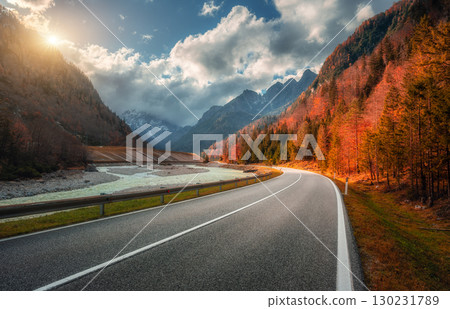 Winding mountain road at colorful sunset in golden autumn 130231789