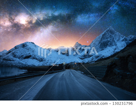Bright Milky Way, road and snowy mountains at winter starry night 130231796