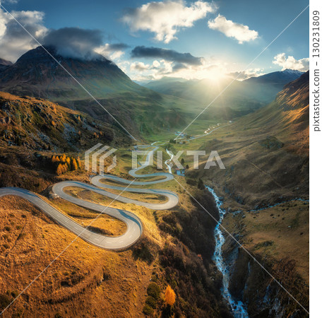 Aerial view of winding mountain road in the Swiss Alps 130231809