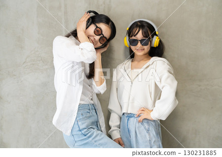 A close parent and child enjoying dancing while listening to music 130231885
