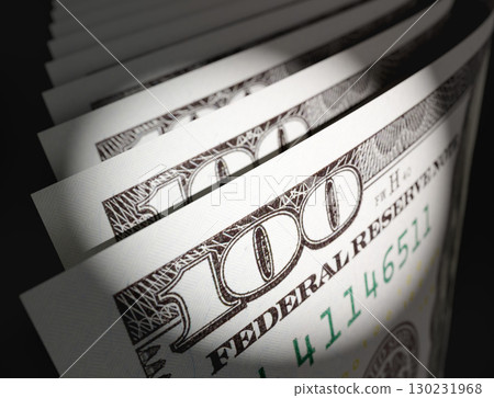 Spot Lit Abstract CLose-up Angle of U.S. 100 Dollar Bills Isolated on a Black Background. Spot Lit Abstract CLose-up Angle of U.S. 100 Dollar Bills Isolated on a Black Background. 130231968