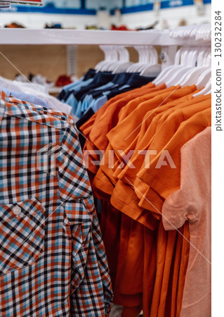 casual bright clothes for children, simple and comfortable, in baby store. sale. closeup. casual bright clothes for children, simple and comfortable, in baby store. sale. closeup. 130232284