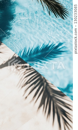Palm shadows on tranquil pool water 130233085