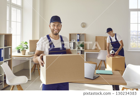 Young mover male team carrying boxes, moving, individual or company worker job moving things Young mover male team carrying boxes, moving, individual or company worker job moving things 130234383