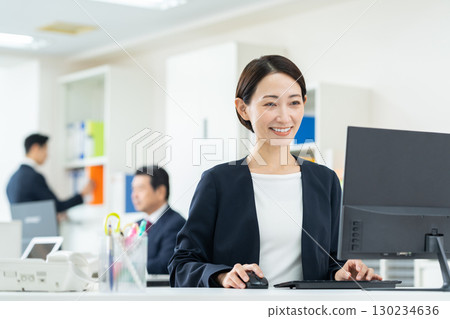 Middle business woman working in the office 130234636
