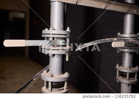 The system of industrial valves and pipes utilized in the facility is essential and intricate The system of industrial valves and pipes utilized in the facility is essential and intricate 130235702