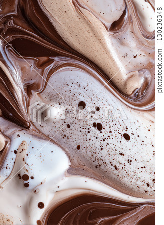 Fluid art where coffee and milk mix together 130236348