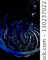 Water pouring into a blue vessel 130237022