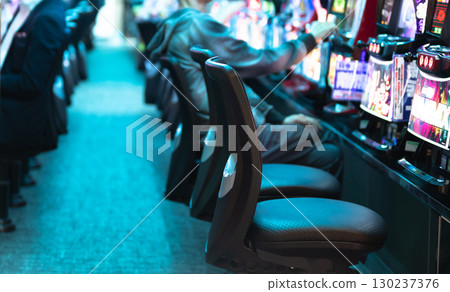 People playing slot machines 130237376