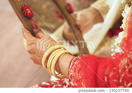 Bridal hands adorned with elegant traditional jewelry Bridal hands adorned with elegant traditional jewelry 130237740