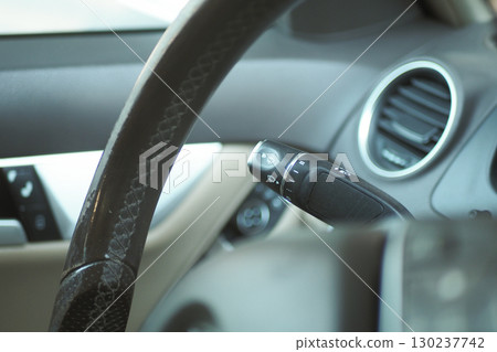 Detailed view of car interior with steering wheel controls Detailed view of car interior with steering wheel controls 130237742