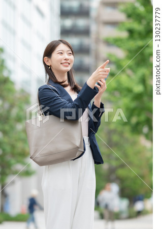 Business woman with a smartphone Business woman with a smartphone 130237779