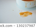 Spilled soup on a clean white table surface 130237987