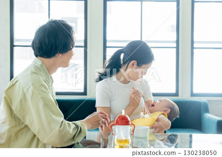 Baby eating baby food 130238050
