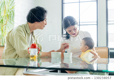 Baby eating baby food 130238057