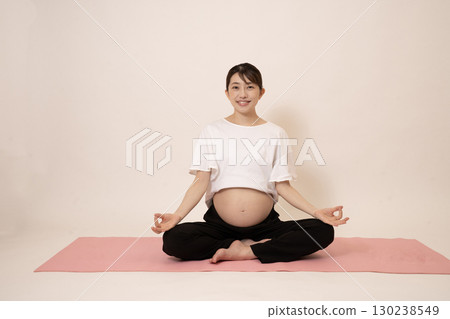 A woman doing maternity yoga 130238549