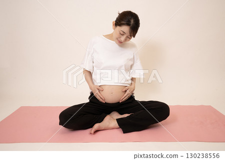A woman doing maternity yoga 130238556