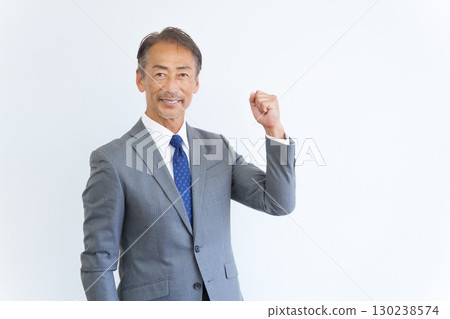 Senior businessman who plays guts pose 130238574