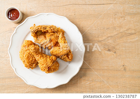 fried chicken with ketchup on plate fried chicken with ketchup on plate 130238787