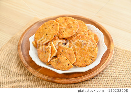 Black sesame rice crackers Black sesame rice crackers 130238908