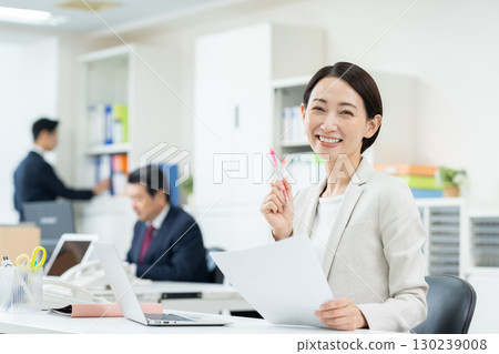 Middle career woman working in the office Middle career woman working in the office 130239008