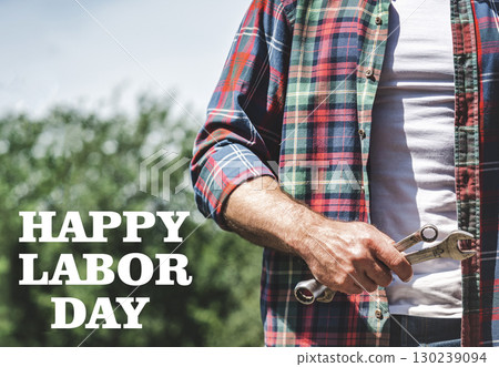 Happy Labor Day. Handsome man and spanners 130239094
