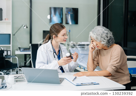 Psychology, depression. Suffering senior woman, consulting with psychologist, psychiatrist while patient counseling mental problem. Psychology, depression. Suffering senior woman, consulting with psychologist, psychiatrist while patient counseling mental problem. 130239392