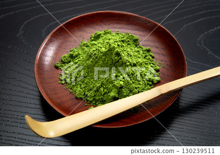 Matcha powder used in Japanese tea ceremonies 130239511