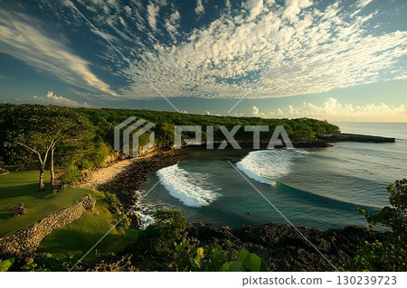 Coastal Serenity: Waves Break on Secluded Beach Under Dramatic S Coastal Serenity: Waves Break on Secluded Beach Under Dramatic S 130239723