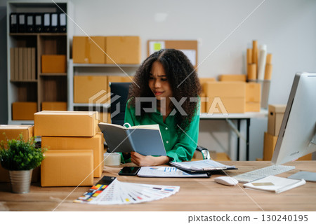 eelance woman working at home office, BOX,tablet and laptop online, marketing, packaging, delivery,  e-commerce concept eelance woman working at home office, BOX,tablet and laptop online, marketing, packaging, delivery,  e-commerce concept 130240195